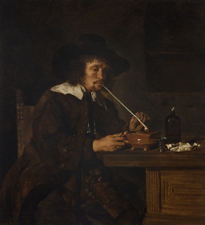 A smoker lighting his pipe