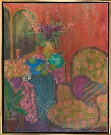 Interior scene with a chair and a vase of flowers.