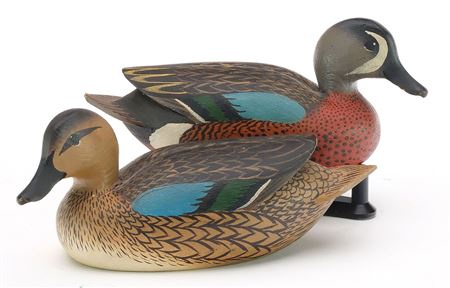 Miniature pair of bluewing teal with raised wingtips and slightly turned head (2)