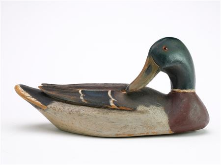 Exceedingly rare preening mallard with deep relief wing carving and recessed area carved in back for the bill to fit in to.