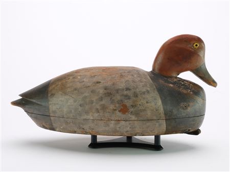 Hollow carved redhead with inlet neck seat, glass eyes, and relief wing tip carving
