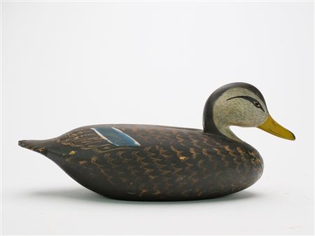 Unused black duck with with painted tack eyes, scratch feather paint detail, and fluted tail carving.