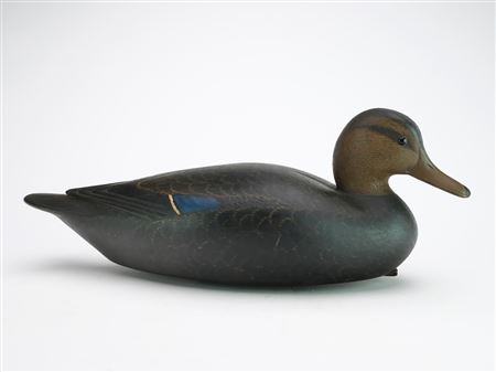 Hollow carved black duck with slightly turned head and relief wingtip carving