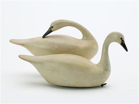 Pair of miniature swans with slight relief wing carver.