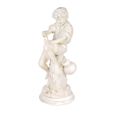 AN ITALIAN ALABASTER FIGURE OF A BOY FISHING