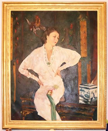 Portrait of Dame Judith Anderson sitting by Asian stand with Canton jar