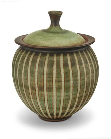 A glazed stoneware lidded jar
