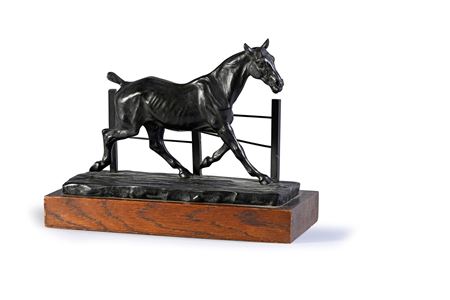Trotting horse in front of a fence