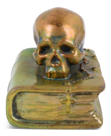 EOSIN-GLAZED SKULL AND ROSARY ON TOP OF A BIBLE