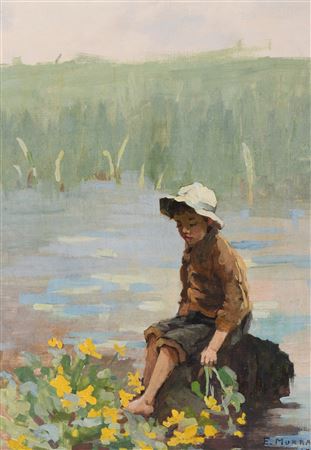 YOUNG BOY SITTING ON A ROCK ON WATERS EDGE