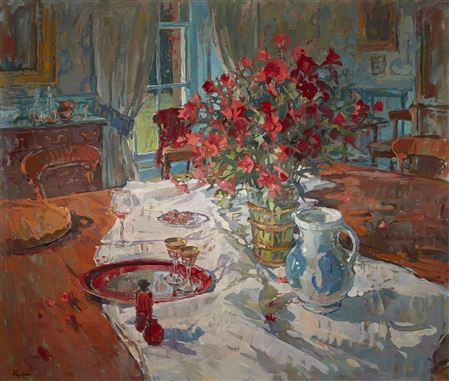 Dining room scene with red flowers;