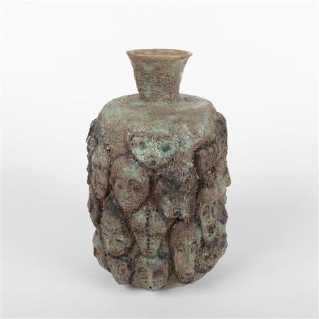 Tall Vessel With Multiple Faces