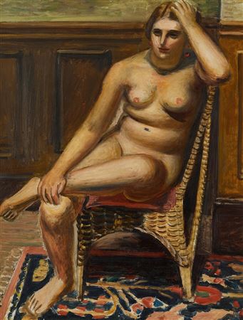 Nude sitting in rattan chair