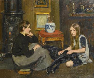 Two girls with a dog in front of a warming stove