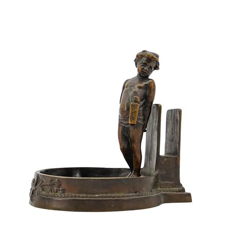 Young Boy Standing Beside a Vertical Backplate