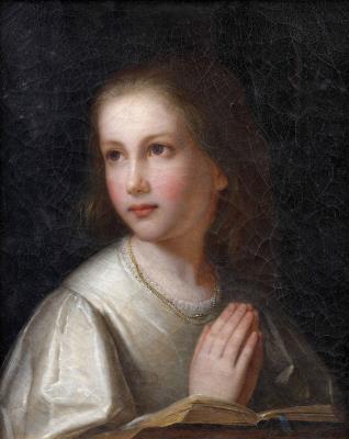 Portrait of a young girl at prayer