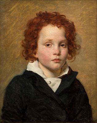 Portrait of a young boy with red hair