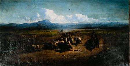 Bulls and gardian on horseback at the foot of the mountain