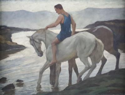Athletic rider with two horses on the riverbank