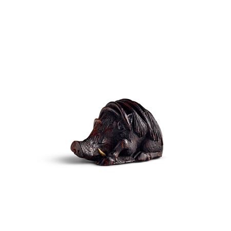 A Wood Netsuke of a Sleeping Boar