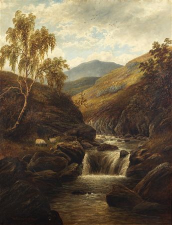 Sheep grazing beside a waterfall