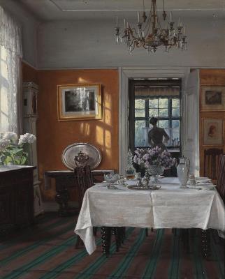 A sunny interior with a woman with her back turned