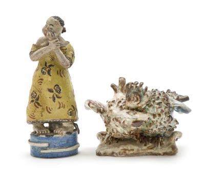 Two stoneware figures modelled in the shape of a standing female and a figure group with two birds.