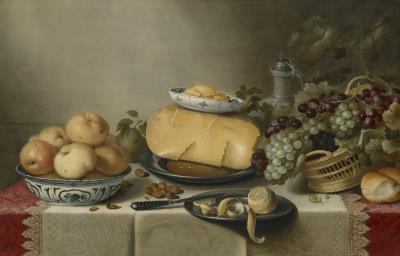Cheese and a butter dish on a pewter plate, apples in a porcelain bowl, a basket of grapes, and a partially peeled lemon on a pewter plate, with an earthenware jug and a knife on a draped table with lace-trimmed runner