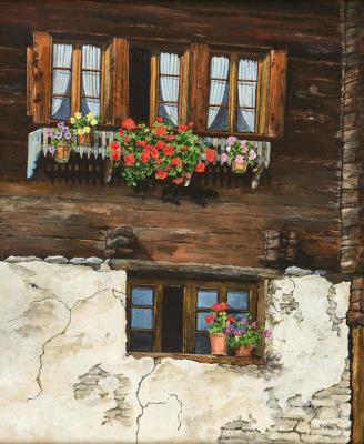 Walliser Hausfassade mit Geranien