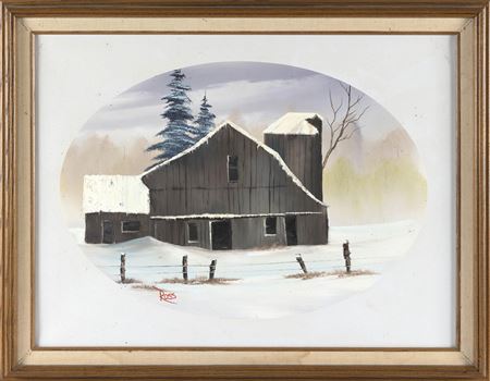 Snow-capped barn and trees behind a post and wire fence.