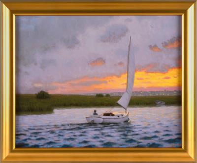 Catboat sailing at sunset