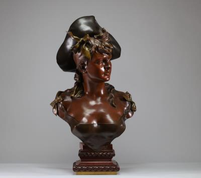 Imposing patinated bronze bust of a young woman with a large hat adorned with ribbons, on a red marble base