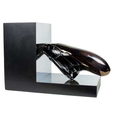 Black iridescent glass sculpture on mirrored stand