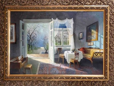 Biedermeier interior with set coffee table and view of the blossoming orchard