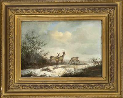 Winter landscape with grazing deer