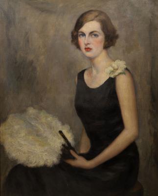 Young woman holding a feathered fan