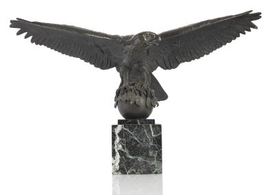 Large eagle with spread wings on a sphere