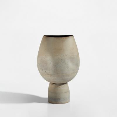 Footed pot with four indents