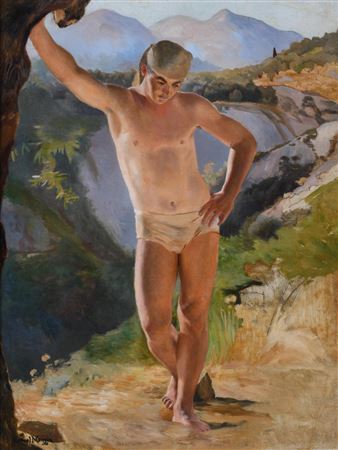 YOUNG MAN LEANING ON A TREE
