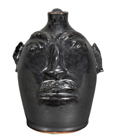 1/2 Gallon Face Jug by Evan Brown - Auction record, sale price, and art valuation. Compare with similar artists and explore comparable artworks.