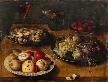 Still life with apples, nuts, grapes and strawberries on a ledge