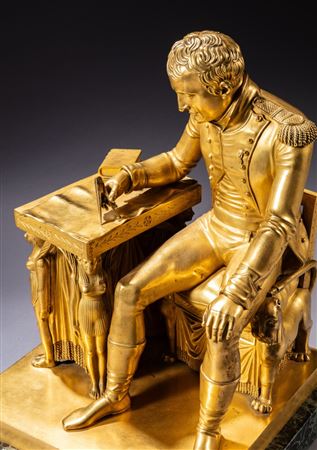 The Emperor Napoleon seated at his work table, studying a map of Europe