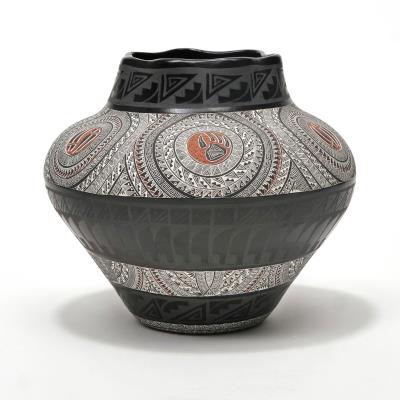 Southwest Studio pottery blackware vase, intricately decorated all around with sgraffito geometric patterns & bear paw motifs, and having a base decorated with a scene depicting an antlered animal