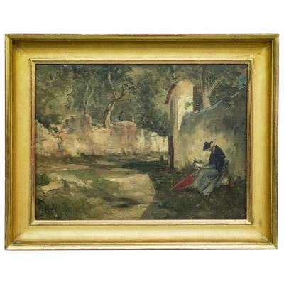A solitary figure seated along a stone wall within a wooded landscape