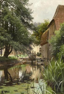 View of a watermill and a stream with calm water