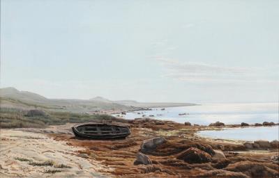 A view of a coast with a dinghy in the seaweed