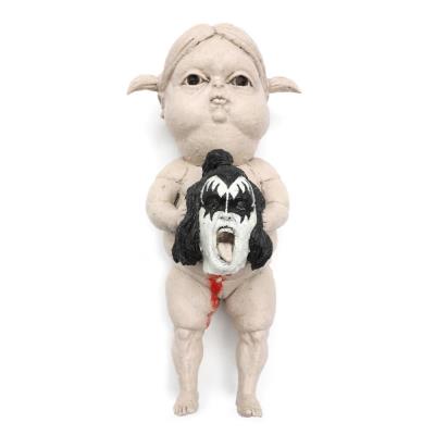 A girl holding Gene Simmons' severed head