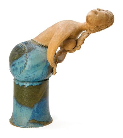 Figure in the shape of a mermaid