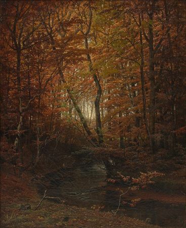 Autumn forest with a running stream