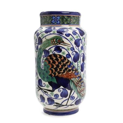 A cylindrical faience vase with short neck, decorated in colours with bird